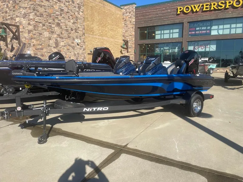 Slide: The Image of 2025 Nitro Z18 boat displayed outside a Powersports store. - 0