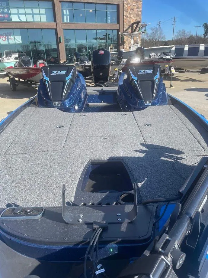 Slide: The Image of 2025 Nitro Z18 boat with dual engines, displayed outdoors on a sunny day. - 1