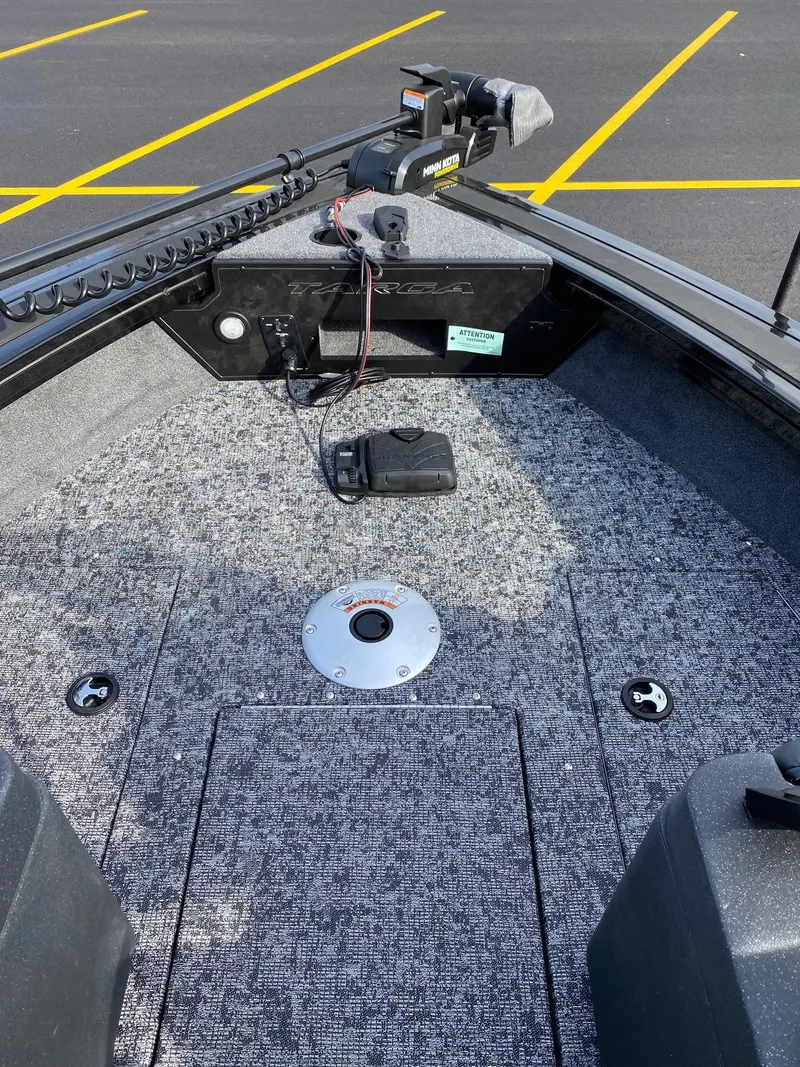 Slide: The Image of 2025 Tracker Targa V-18 WT boat deck with fishing equipment. - 11