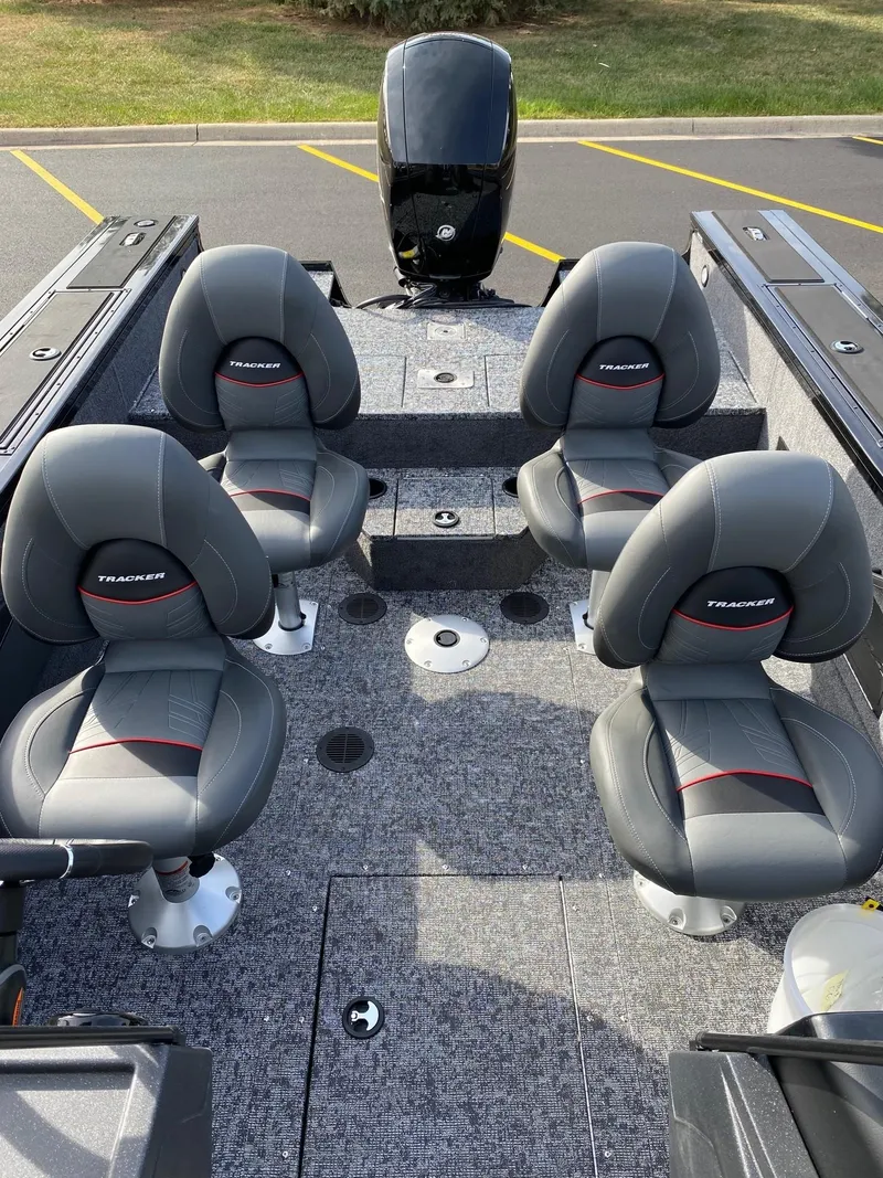 Slide: The Image of 2025 Tracker Targa V-18 WT boat interior with four gray seats. - 12