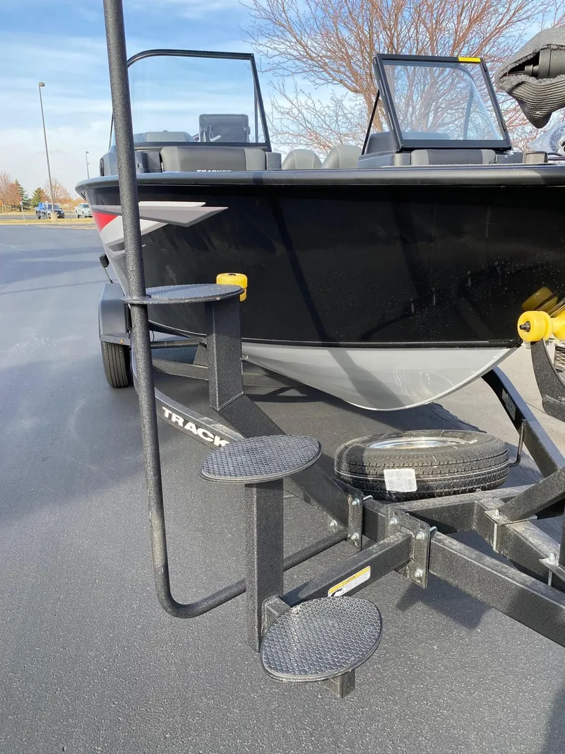 Slide: The Image of 2025 Tracker Targa V-18 WT boat on trailer with step ladder. - 14