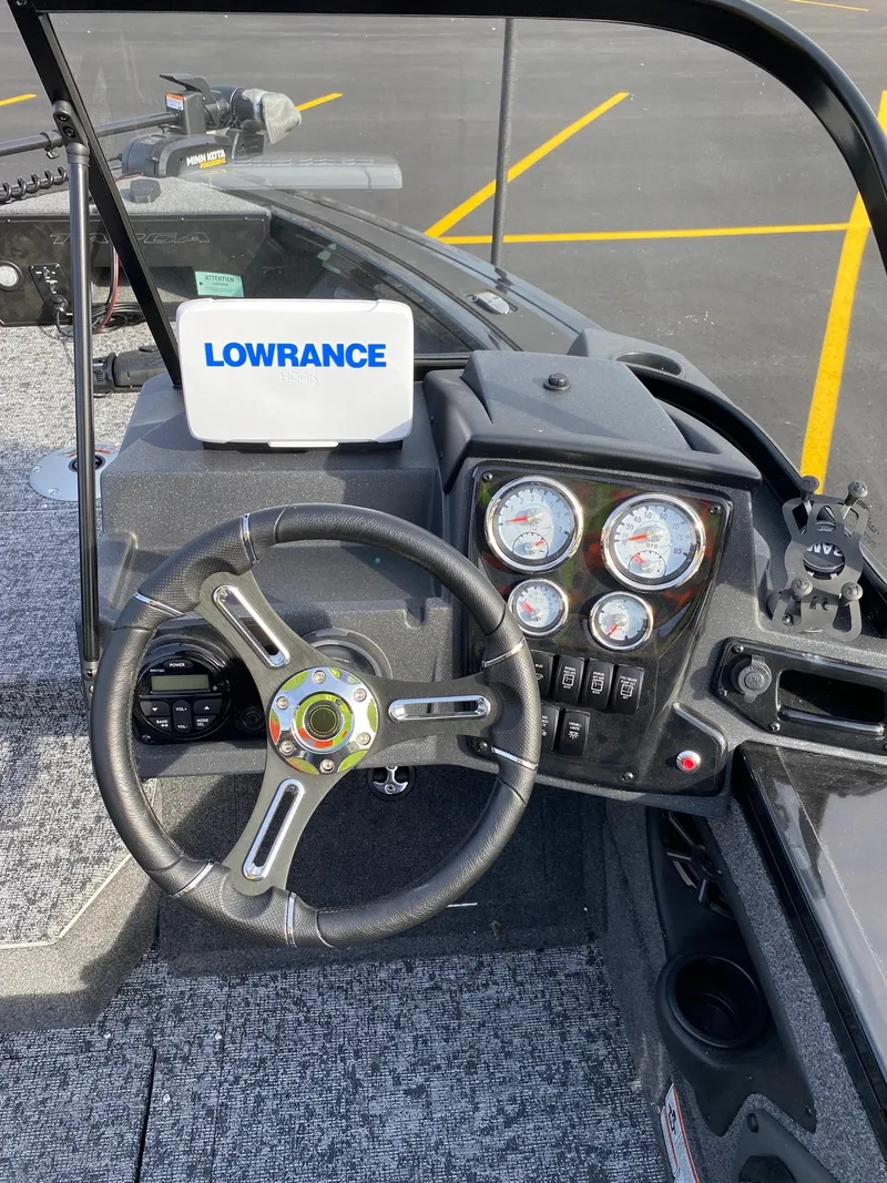 Slide: The Image of 2025 Tracker Targa V-18 WT boat dashboard with Lowrance navigation system. - 9