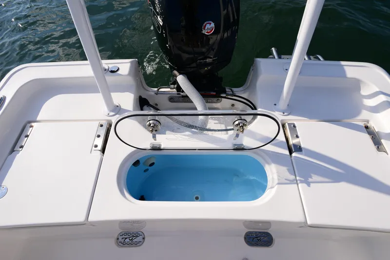 Slide: The Image of 2022 Tidewater 2110 Bay Max boat stern with livewell and motor. - 26