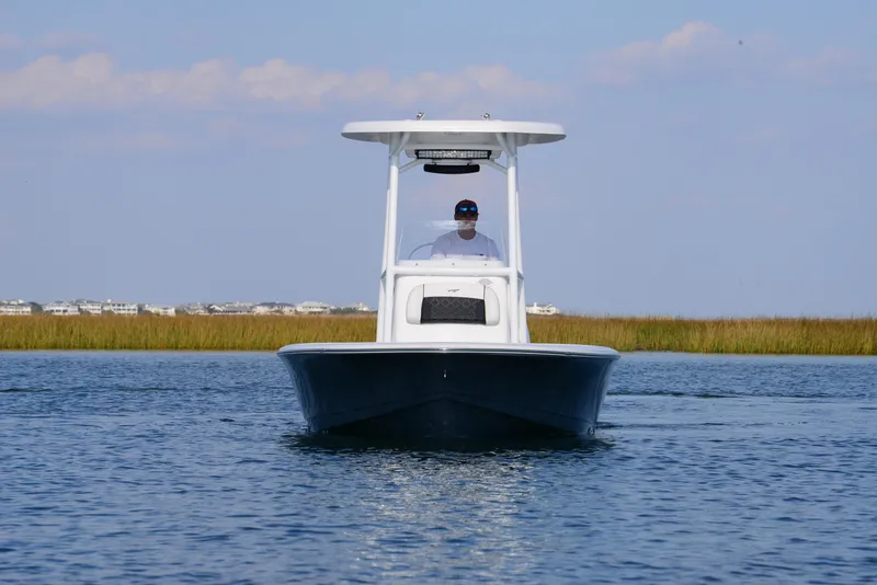 Slide: The Image of 2022 Tidewater 2110 Bay Max boat cruising on calm water. - 4