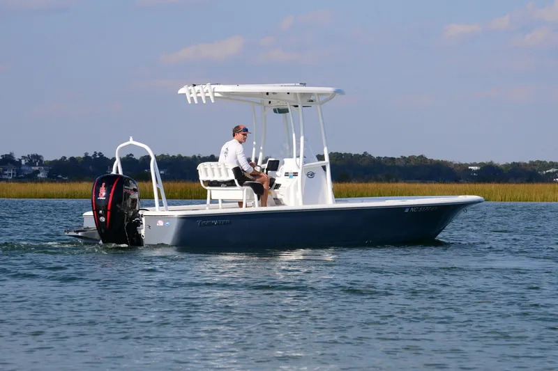 Slide: The Image of 2022 Tidewater 2110 Bay Max boat cruising on calm water. - 7