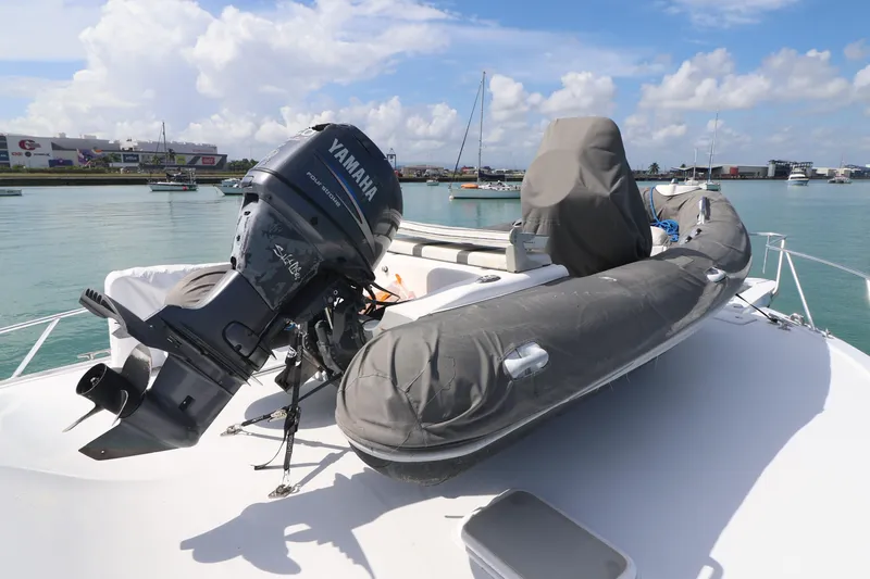 Slide: The Image of 2004 Hatteras 54 Convertible yacht with Yamaha outboard motor and inflatable boat on deck. - 18