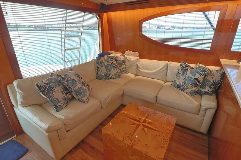 Slide: The Image of Luxurious interior of 2004 Hatteras 54 Convertible yacht with plush seating and nautical decor. - 27