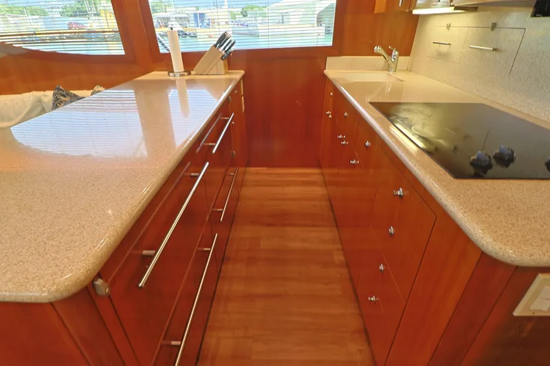 Slide: The Image of Luxurious kitchen interior of 2004 Hatteras 54 Convertible yacht with modern appliances. - 30
