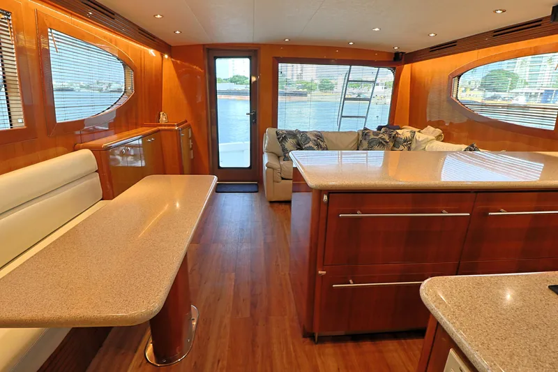 Slide: The Image of Luxurious interior of 2004 Hatteras 54 Convertible yacht with elegant wood finishes. - 32