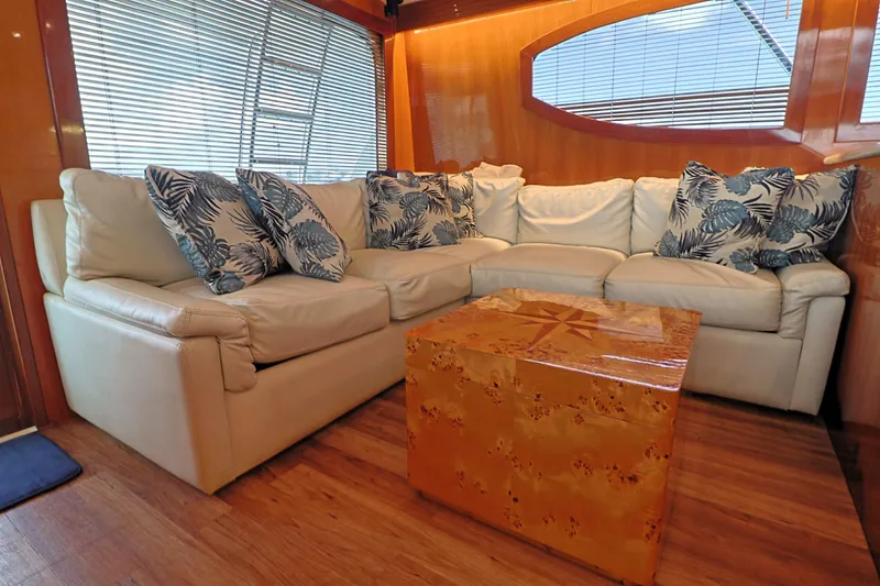 Slide: The Image of Luxurious interior of 2004 Hatteras 54 Convertible yacht with plush seating and decorative pillows. - 34