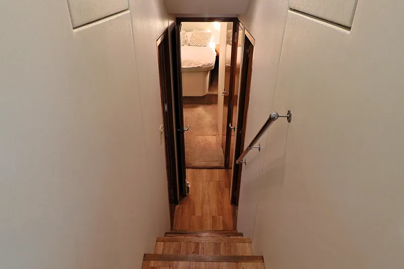 Slide: The Image of Stairway leading to cabin interior of 2004 Hatteras 54 Convertible yacht. - 35