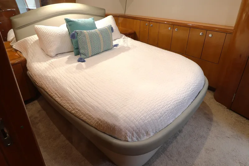 Slide: The Image of Luxurious bedroom interior of 2004 Hatteras 54 Convertible yacht with elegant bedding. - 36