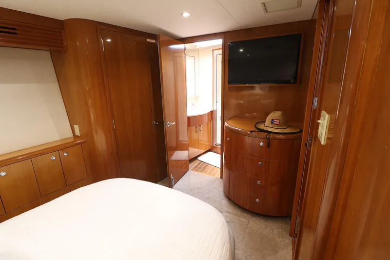 Slide: The Image of Luxurious cabin interior of 2004 Hatteras 54 Convertible yacht with wood finish. - 37