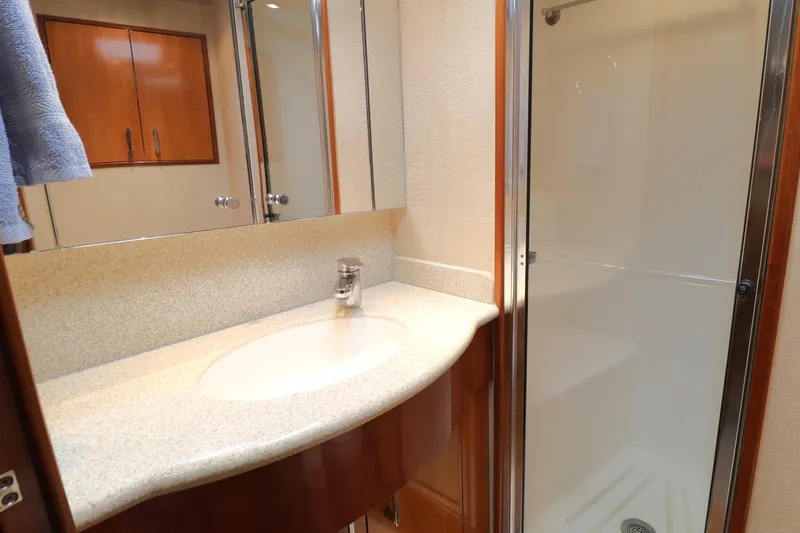 Slide: The Image of Bathroom interior of 2004 Hatteras 54 Convertible yacht with sink and shower. - 40