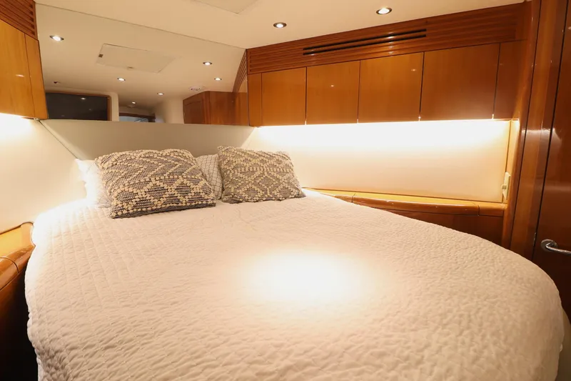 Slide: The Image of Luxurious bedroom interior of 2004 Hatteras 54 Convertible yacht with cozy bedding. - 43