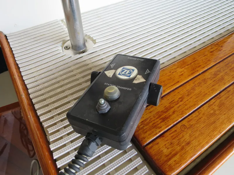 Slide: The Image of Remote control on DeFever 53POC yacht, 1988 model, placed on wooden and metal surface. - 11