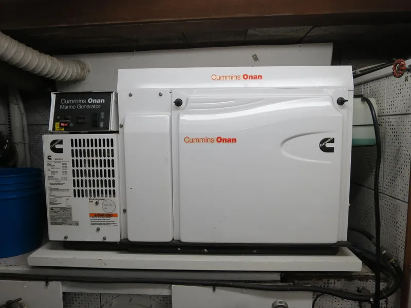 Slide: The Image of Cummins Onan marine generator in a 1988 DeFever 53POC yacht engine room. - 18