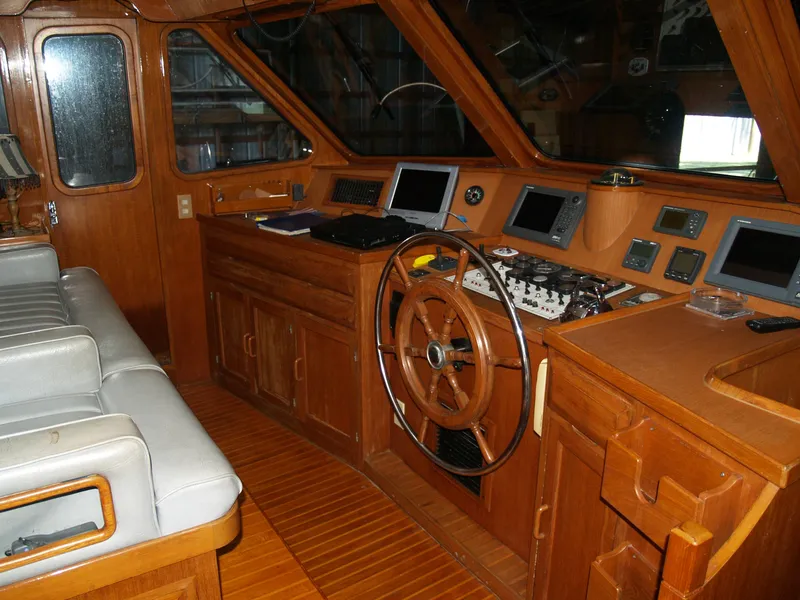 Slide: The Image of 1988 DeFever 53POC yacht helm with wooden interior and navigation equipment. - 26