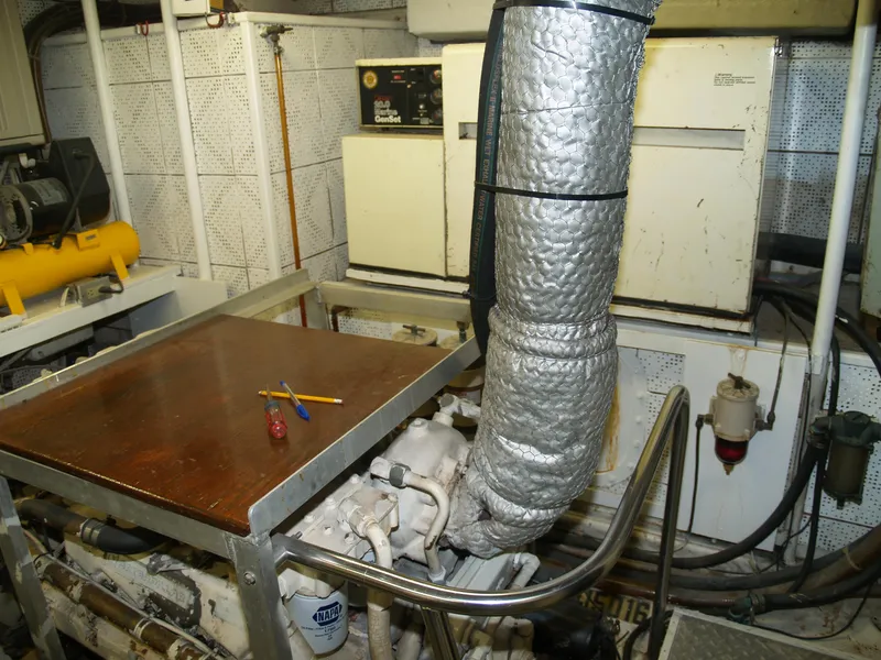 Slide: The Image of Engine room of 1988 DeFever 53POC yacht with tools and equipment. - 31