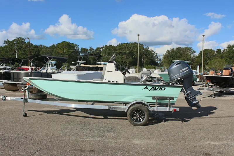 The Image of 2025 Avid 18 Rogue CC boat on trailer, parked outdoors. - 1