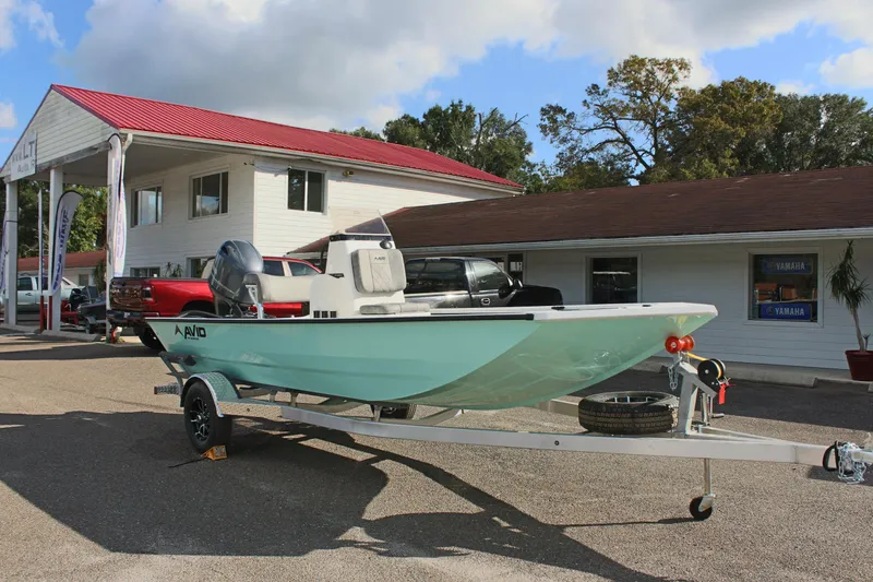 Slide: The Image of 2025 Avid 18 Rogue CC boat on trailer outside dealership. - 5