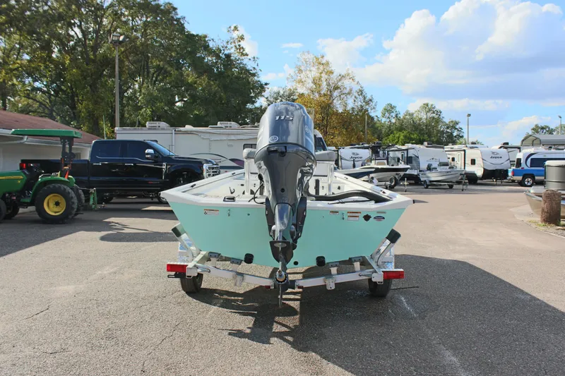 Slide: The Image of 2025 Avid 18 Rogue CC boat on trailer in parking lot. - 8