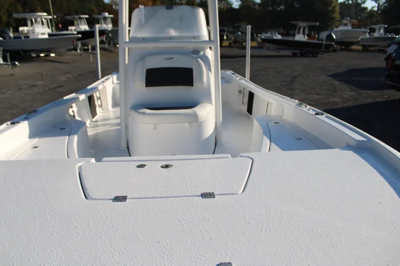 Slide: The Image of 2025 Tidewater 2210 Carolina Bay boat interior, showcasing spacious deck and seating area. - 14