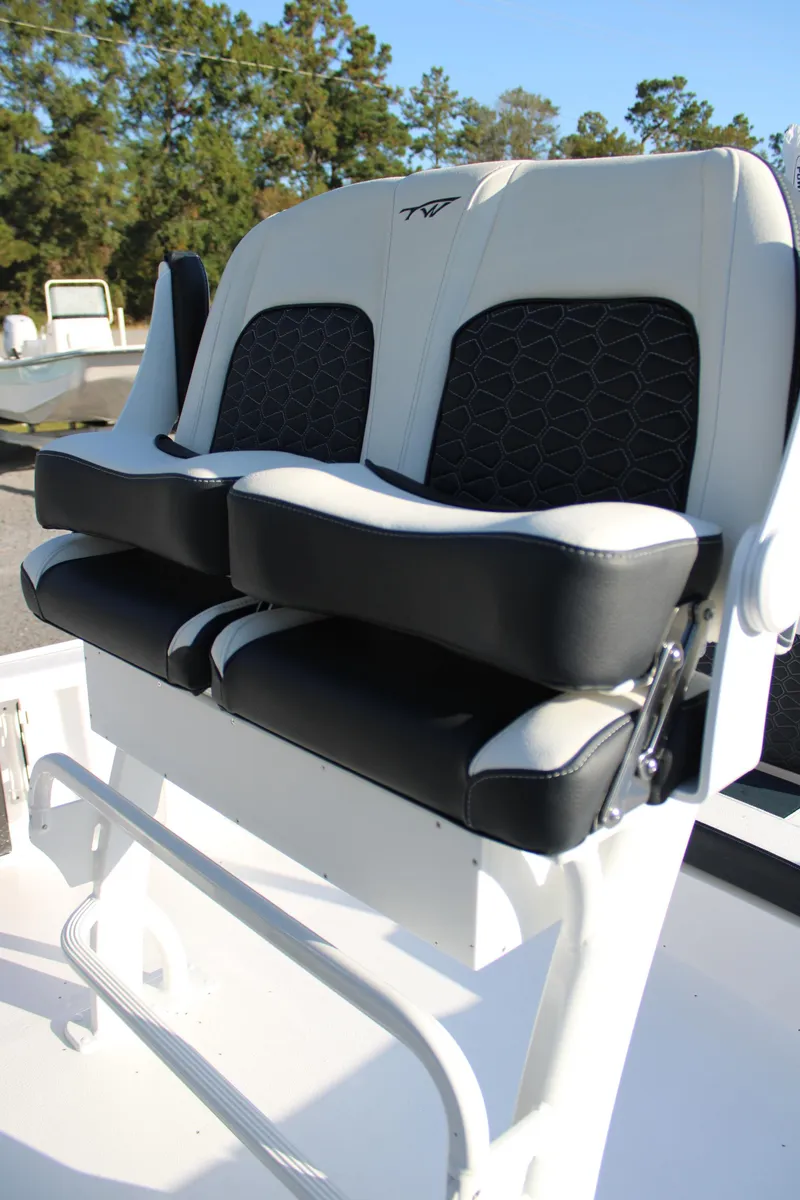 Slide: The Image of 2025 Tidewater 2210 Carolina Bay boat seats with black and white upholstery. - 23