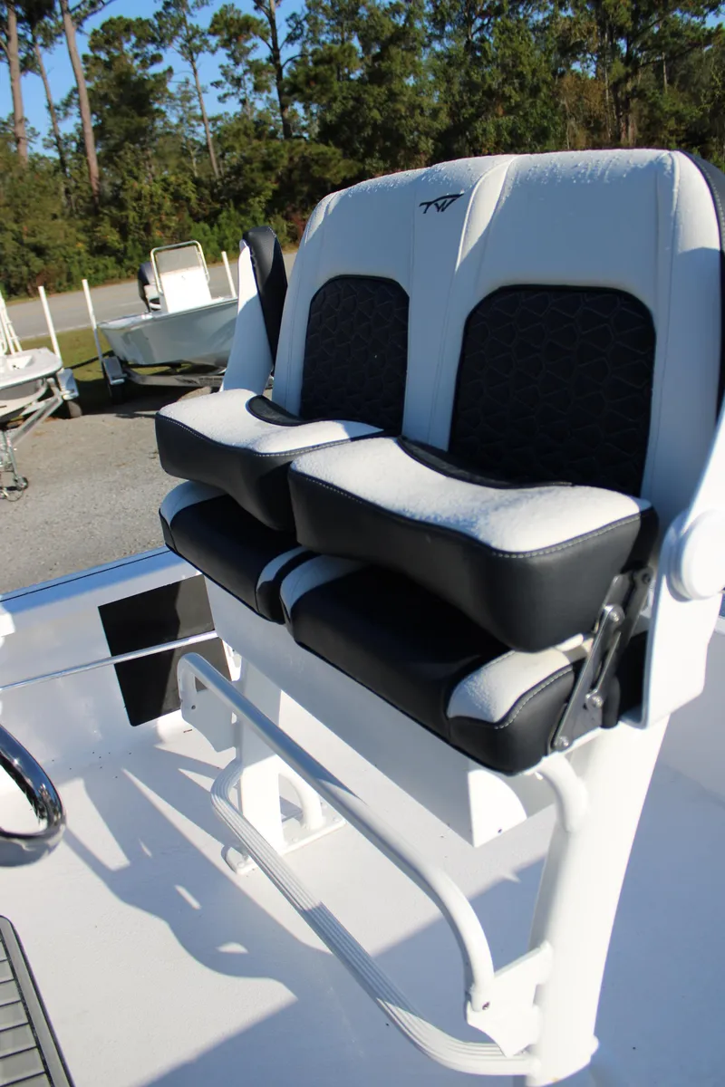 Slide: The Image of 2025 Tidewater 2210 Carolina Bay boat seats with black and white upholstery. - 25