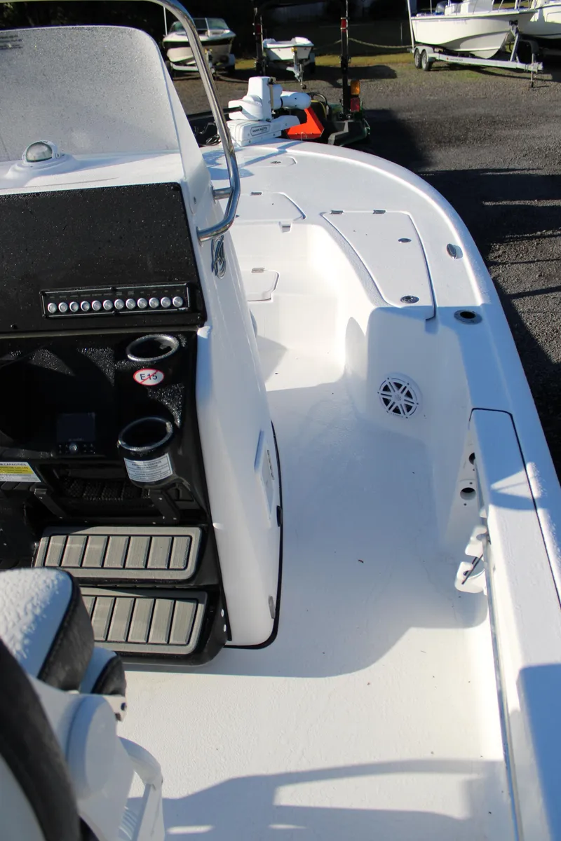 Slide: The Image of 2025 Tidewater 2210 Carolina Bay boat interior with console and seating area. - 26
