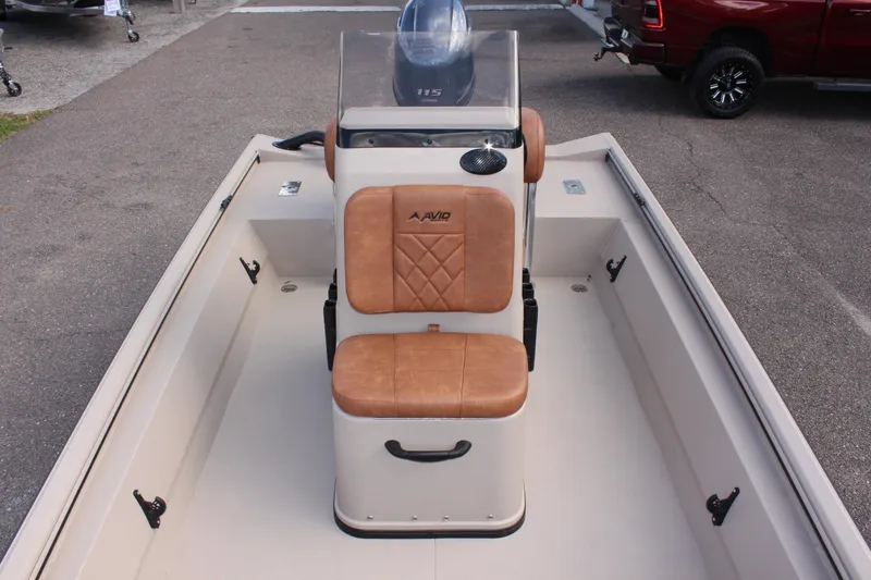 Slide: The Image of 2025 Avid 18 Rogue CC boat with tan seating and center console. - 20