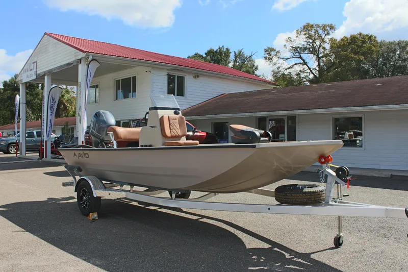 Slide: The Image of 2025 Avid 18 Rogue CC boat on trailer outside dealership. - 5