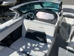 Slide: The Image of 2021 MasterCraft XStar boat interior with modern dashboard and seating. - 11