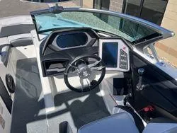 Slide: The Image of 2021 MasterCraft XStar boat interior with modern dashboard and steering wheel. - 13