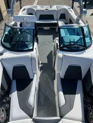 Slide: The Image of 2021 MasterCraft XStar boat interior with sleek seating and modern design. - 14