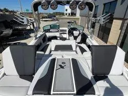 Slide: The Image of 2021 MasterCraft XStar boat interior with sleek seating and modern design. - 4