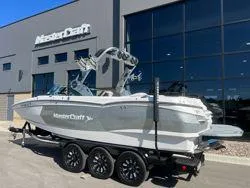 Slide: The Image of 2021 MasterCraft XStar boat on trailer outside dealership. - 6