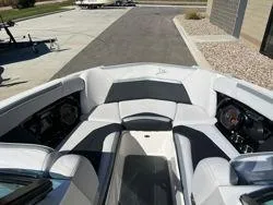 Slide: The Image of 2021 MasterCraft XStar boat interior with sleek seating and dashboard. - 9