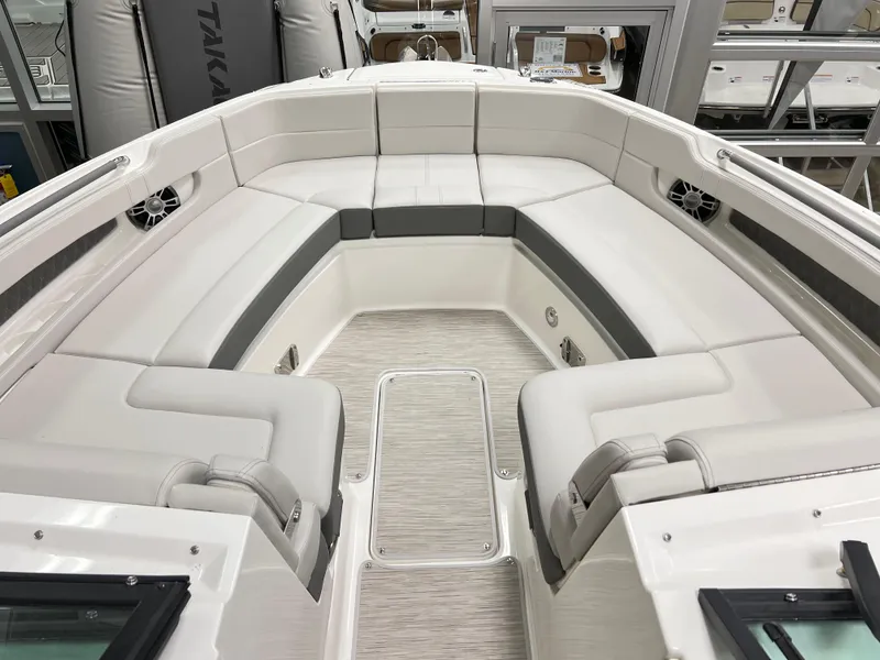 Slide: The Image of 2025 Sea Ray SLX 310 boat interior with luxurious seating and modern design. - 13