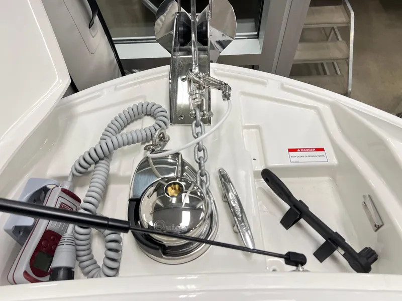 Slide: The Image of 2025 Sea Ray SLX 310 boat anchor system with coiled rope and chain. - 14
