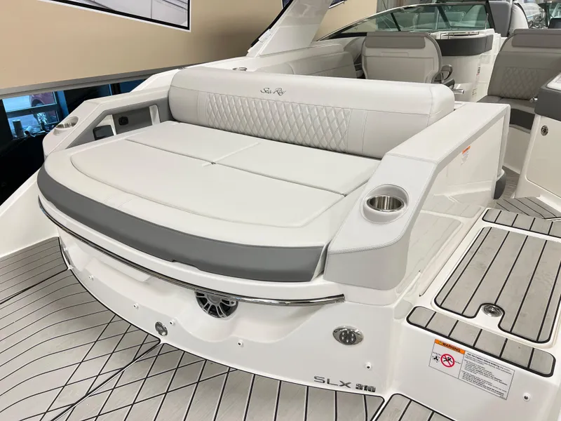 Slide: The Image of 2025 Sea Ray SLX 310 boat interior with luxurious seating and modern design. - 5