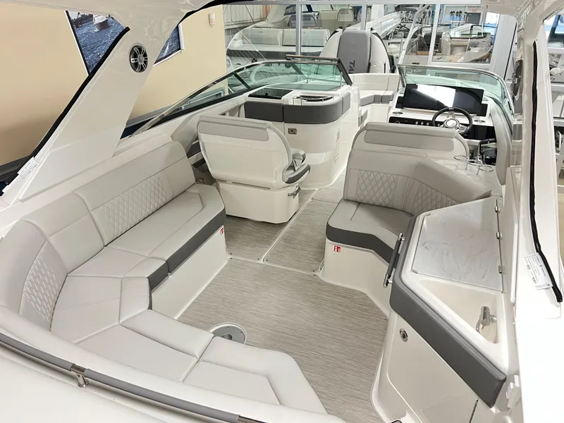 Slide: The Image of 2025 Sea Ray SLX 310 boat interior with luxurious seating and modern design. - 6