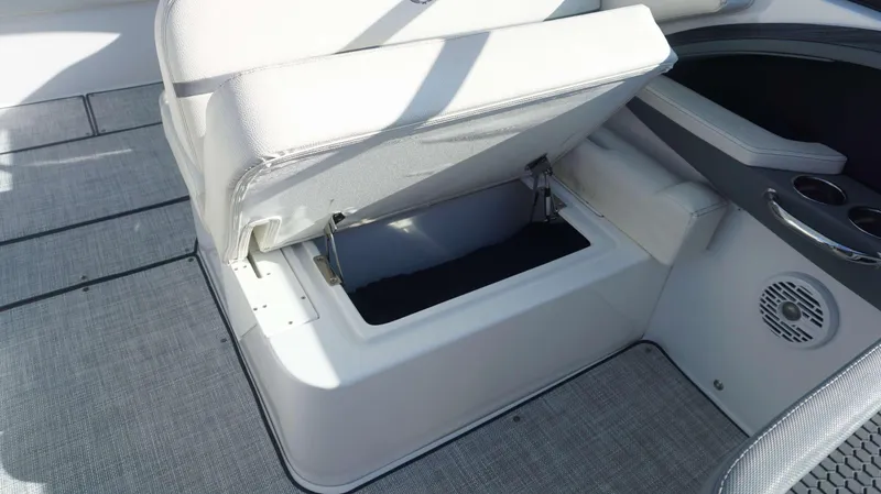 Slide: The Image of 2020 Cobalt 30 SC boat seat with open storage compartment. - 11