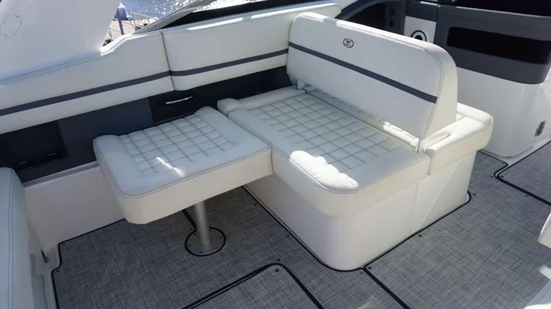 Slide: The Image of Luxurious seating on a 2020 Cobalt 30 SC boat, featuring white cushioned upholstery. - 13