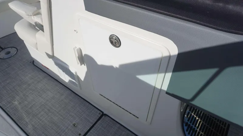 Slide: The Image of 2020 Cobalt 30 SC boat interior with storage compartment and seating. - 20