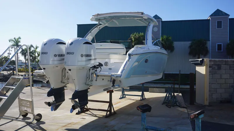 Slide: The Image of 2020 Cobalt 30 SC boat with twin Yamaha 300 engines on a lift. - 3
