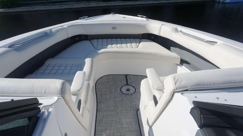 Slide: The Image of 2020 Cobalt 30 SC boat interior with white cushioned seating. - 5