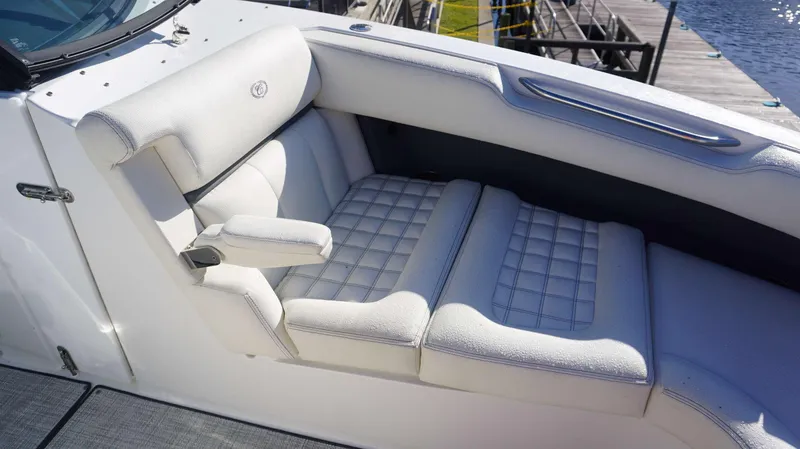 Slide: The Image of 2020 Cobalt 30 SC boat interior with white cushioned seating. - 6