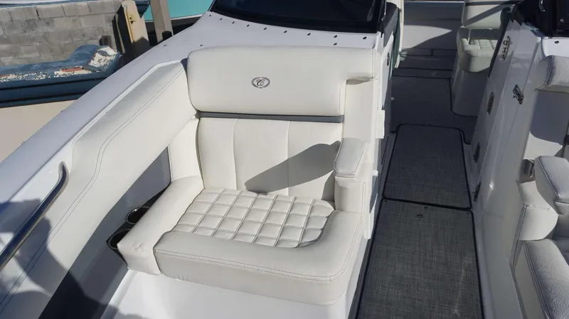 Slide: The Image of 2020 Cobalt 30 SC boat with white leather seating and modern interior design. - 8