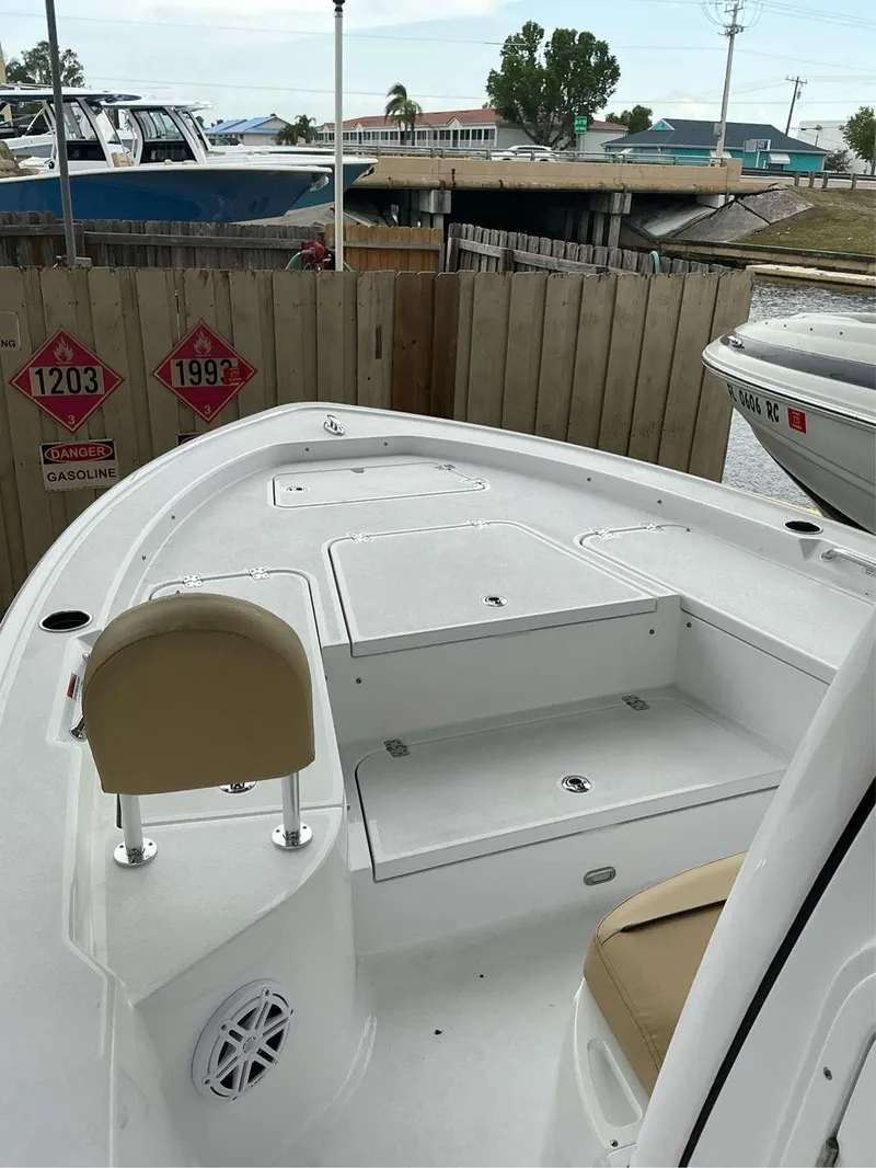 Slide: The Image of 2025 Sportsman 227 MASTERS boat interior with seating and storage compartments. - 5